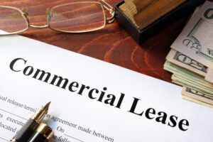 commercial lease agreement with money on a table