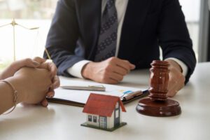 gavel on sounding block in hand's Male judge at a courtroom, working for the insurance compensations