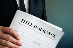 title insurance agreement in the hands of a businessman