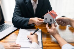 Real estate agent facilitated sale of property through mortgage loan